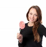 Attractive smiling female holding a lollipop