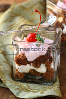 chocolate biscuits with cream , trifle in glasses
