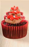 Chocolate cupcakes in red cups