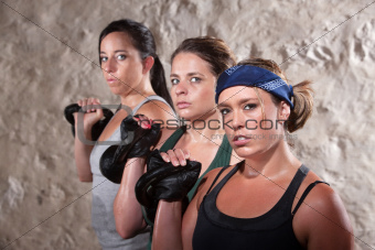 Ladies Lifting Weights in Boot Camp Workout