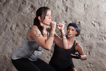 Lady and Trainer Sweating During Boot Camp Style Workout