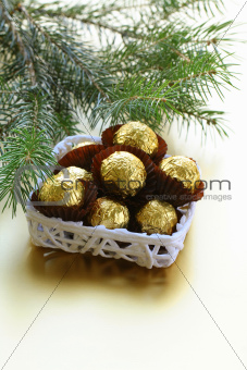 chocolate truffles in a gift box under the Christmas tree