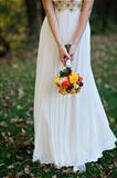 bride holds a bouquet