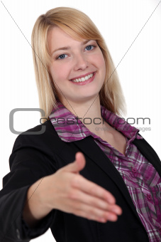 Blond woman holding hand out