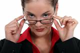 Businesswoman peering over her glasses