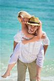 Happy young couple on tropical beach