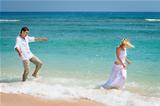 Playful young couple have a fun in tropical sea