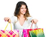 Pretty young woman holding shopping bags
