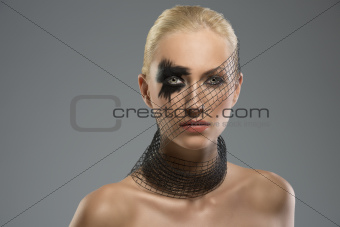 portrait of girl with creative make-up, she looks in to the lens