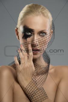 portrait of girl with creative make-up with hand near the face