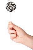Hand holding lollipop