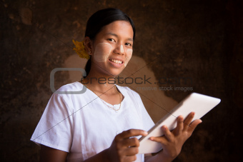 Myanmar girl using tablet computer