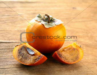Persimmon fruit on a wooden table