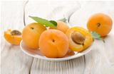 Apricots in a white plate