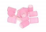 Twelve pink velcro rollers in a jumbled pile