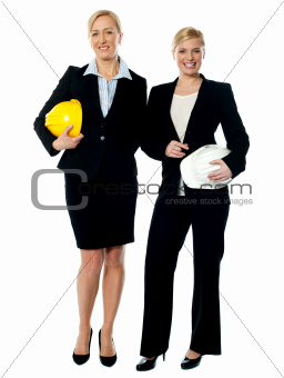 Portrait of two architects with helmets