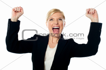 Corporate lady shouting with arms up