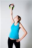 Pregnant woman exercising with kettlebell