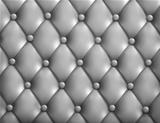 Grey button-tufted leather background