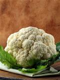 head of  cauliflower on a wooden table