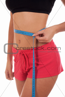 Young woman measuring perfect shape of her body