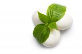 just balls of mozzarella cheese with leaves of basil