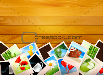 Colorful photos on wooden background