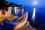 White Boat on the Beach and Transparent Mediterranean Sea in the