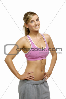 Beautiful young woman in sports wear isolated on a white background