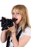 Portrait of the girl eating grapes. Isolated