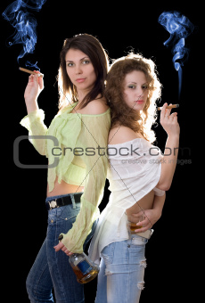 Two pretty girlfriends with a cognac and cigars