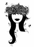 Woman head silhouette with floral wreath