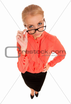 Young woman looking at you over glasses