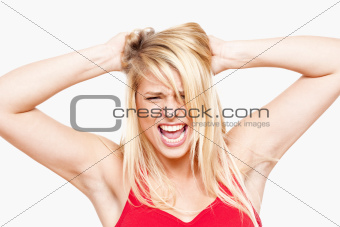 angry, frustrated girl with hands in her hair screaming - isolated on white