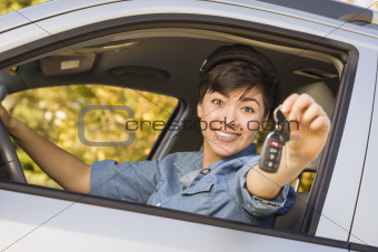Happy Smiling Mixed Race Woman in Car Holding Set of Keys.