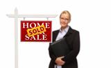 Businesswoman Behind Sold Home For Sale Real Estate Sign Isolated on a White Background.