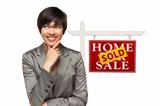 Ethnic Woman in Front of Sold Home For Sale Real Estate Sign Isolated on a White Background.