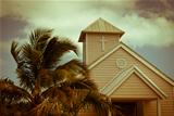 Wooden white church and palm trees, Bahamas