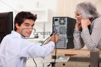 young man trying to repair computer