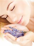 Beautiful girl smell lavender flowers
