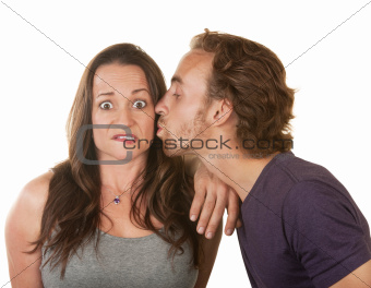 Man Kissing Surprised Woman