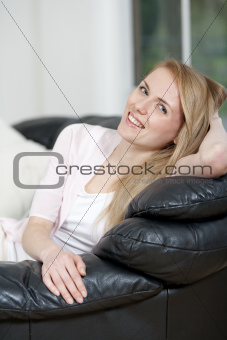 Young woman resting on sofa
