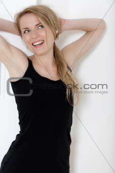 Young woman in black fitness wear