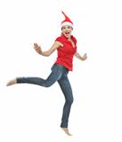 Young woman in Christmas hat jumping
