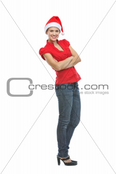 Full length portrait of smiling young woman in Santa hat