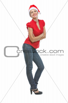 Full length portrait of happy young woman in Santa hat