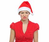 Portrait of sad young woman in Santa hat