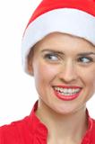 Closeup on smiling young woman in Santa hat