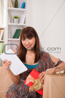 asian girl enjoying online shopping