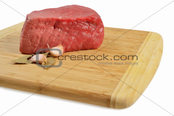 Raw Beef on wooden board